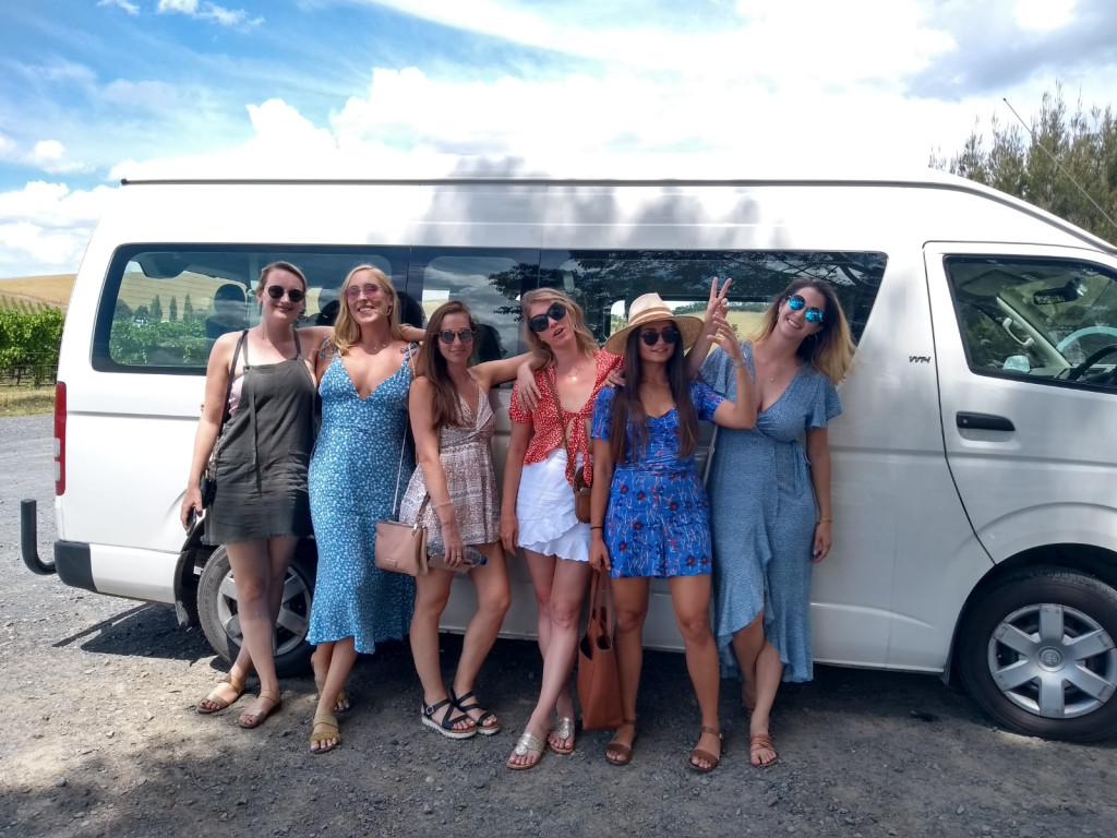 Small group boarding an air-conditioned tour bus for a Yarra Valley wine tour from Melbourne